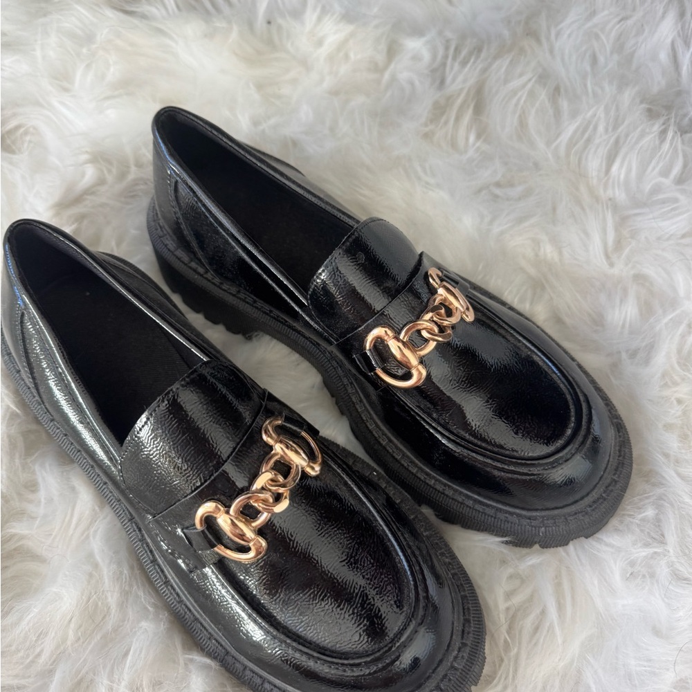 Women’s black and gold loafers